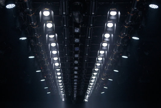 Performance moving lighting on construction light beam ray