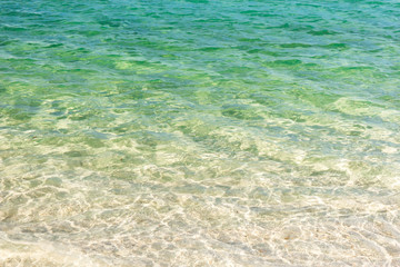 Fototapeta na wymiar Clear blue transparent tropical summer beach water background