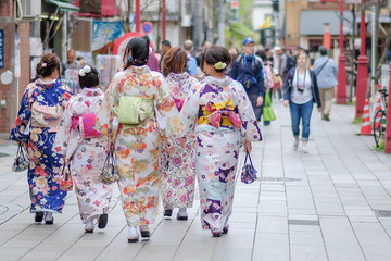 Fototapeta na wymiar Kimono woman walking at Sensoji or Asakusa Kannon Temple is a Buddhist temple located in Asakusa, landmark and popular for tourist attractions. 7 April 2018, Tokyo, Japan