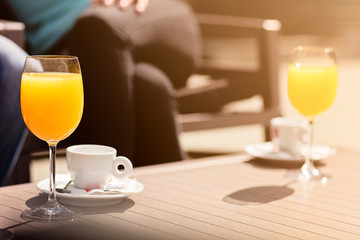 Flirting in a cafe. Beautiful loving couple sitting in a cafe enjoying in coffee and conversation. Love, romance, dating