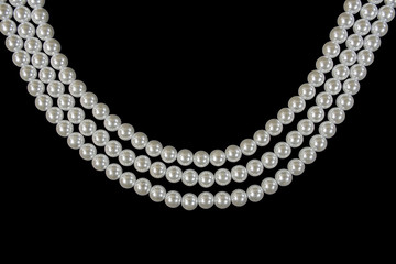 three strand pearl necklace on black background