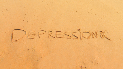 depression concept, word depression written on the sand