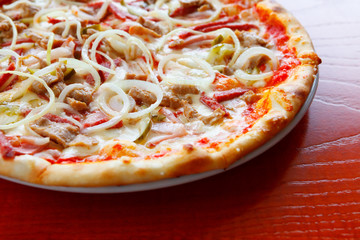 Pizza with cold cuts and toppings, close-up, soft focus, selective focus