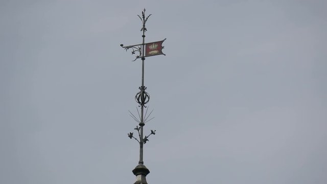 A lightning rod on top of a building