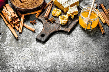 Fresh honey with cinnamon sticks.