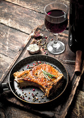 Grilled pork steak with red wine.