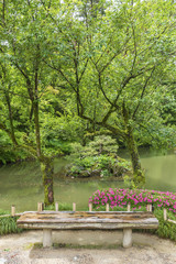 Wooden seat in Japanese garden in Kanazawa, Japan