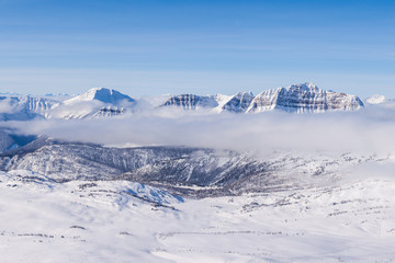 An aerial view of the Rocky Mountains in Alberta, Canada in winter