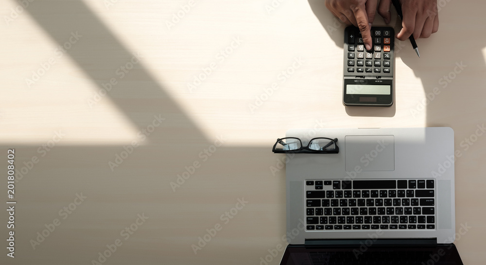 Poster close up businessman using calculator on documents unrecognizable finance use calculate about cost a