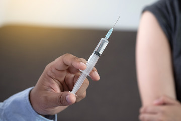 Medicine and health care concept Doctor giving patient vaccine insulin or vaccination