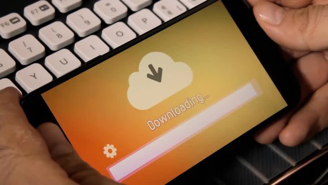 Browsing or watching on a smartphone: downloading a file or resource from the cloud. Rainbow background.
