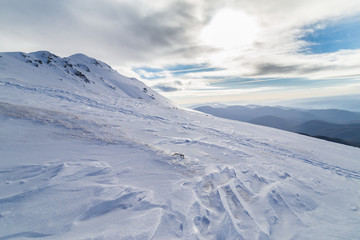 Fototapeta na wymiar Bright winter scenery in the Alps with fresh snow