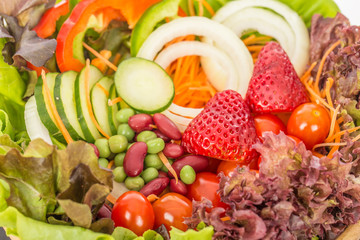 Fresh mix vegetables salad strawberry cucumber and tomato,Healthy Food Concept