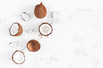 Fototapeta na wymiar Coconut background. Fresh coconuts on white background. Flat lay, top view, copy space