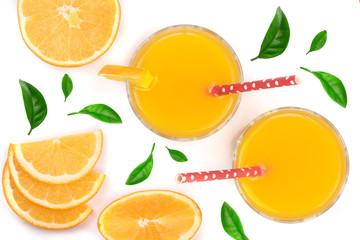 orange juice glass with slices of citrus and green leaves isolated on white background, top view. Flat lay pattern