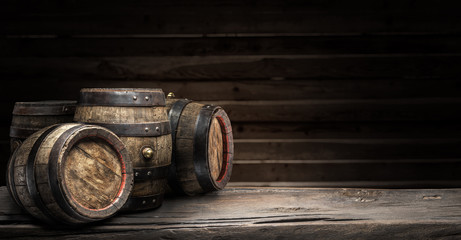 Wine barrels on the old wooden table.