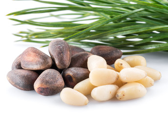 Fototapeta na wymiar Pine nuts on the white background. Organic food.