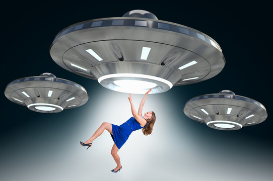 Woman Being Abducted By UFO - Alien Abduction Concept