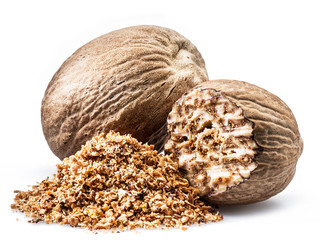 Dried seeds of fragrant nutmeg and grated nutmeg  isolated on white background.