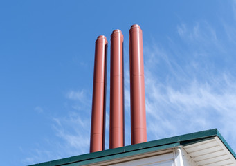 Industrial pipes against the sky
