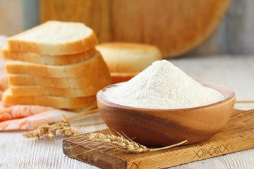 Flour in bowl with grain ears