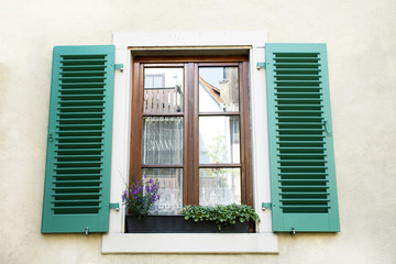 Fototapeta na wymiar Classic retro vintage window on wall of house in Ladenburg town