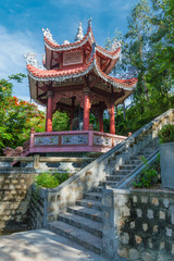 gazebo with a bell in a Buddhist style, on the territory of the active pagoda Long Shon, Nha Trang, Vietnam