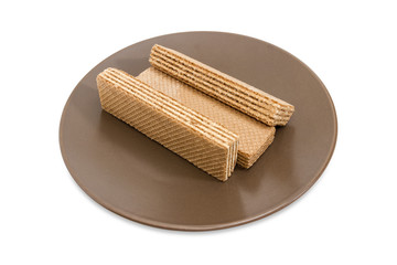 Wafer biscuits on a brown dish