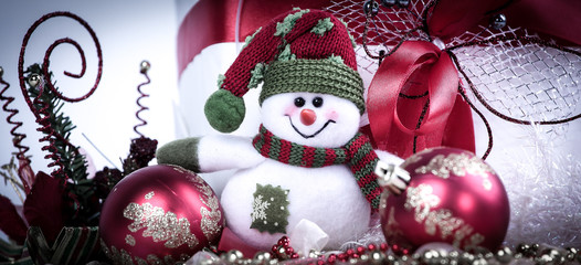 closeup.cute toy snowman and various Christmas decorations