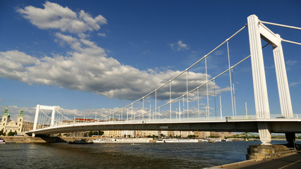 Elisabeth Bridge and the churches on the Pest side of Budapest with cloudy sky 