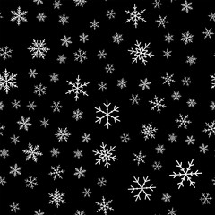 White snowflakes seamless pattern on black Christmas background. Chaotic scattered white snowflakes. Superb Christmas creative pattern. Vector illustration.