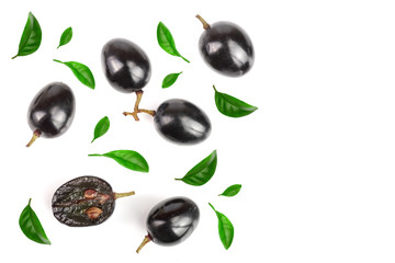 Dark grapes decorated with green leaves isolated on white background with copy space for your text, top view. Flat lay