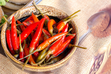 Red fresh pepper spicy in ceramic plate on table street fastival food