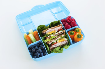 Blue luchbox wiht healty meal top view