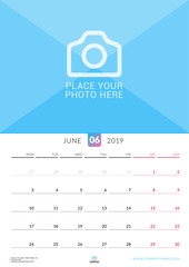 Wall calendar for June 2019. Vector design print template with place for photo. Week starts on Monday. Portrait orientation