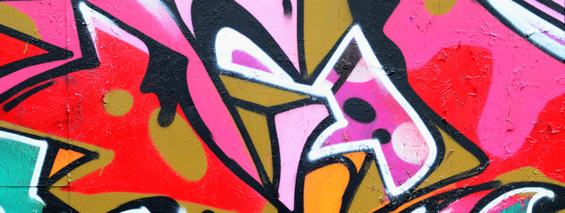 Fragment of a beautiful graffiti pattern in pink and green with a black outline. Street art...