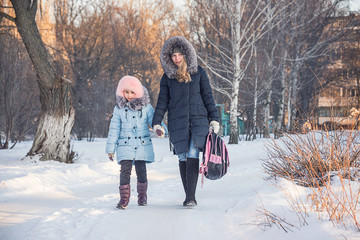 mother and daughter go from school