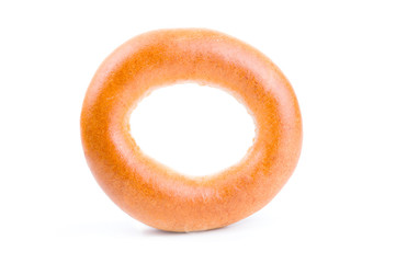 Fototapeta na wymiar One tasty bagel isolated on a white background