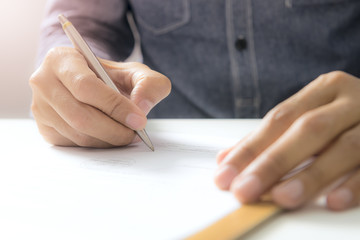 handsome man sign-off on document