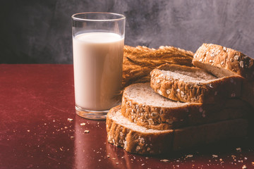 Healthy breakfast with whole wheat bread and milk on the table