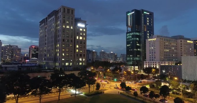 4k aerial footage of Singapore skyscrapers with city skyline during cloudy evening