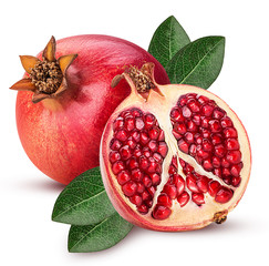 Ripe pomegranate fruit and one cut in half with leaf