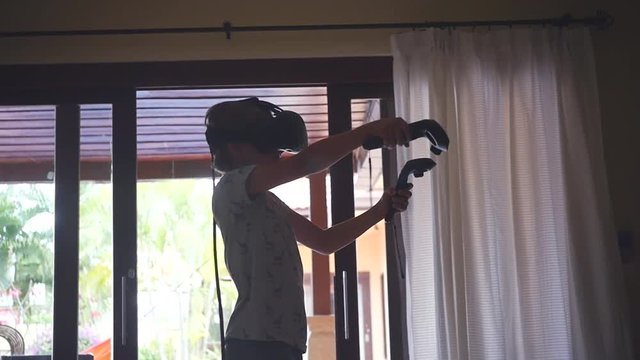 Spend the summer at home playing with virtual glasses and joysticks. slow motion. 1920x1080. full hd