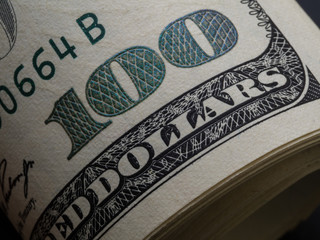 Macro shot of a 100 dollar. Dollars Closeup Concept. American Dollars Cash Money. One Hundred Dollar Banknotes
