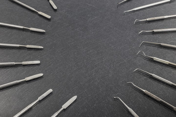 dental instruments on gray background. Top view with copy space for text
