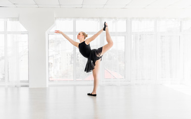 Young ballerina practising ballet moves