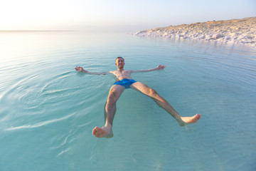 Tourist swims in Dead Sea. Jordan