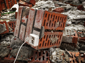 Fragment of the destroyed brick wall. Brickwork. Abandoned building. Grunge architectural background