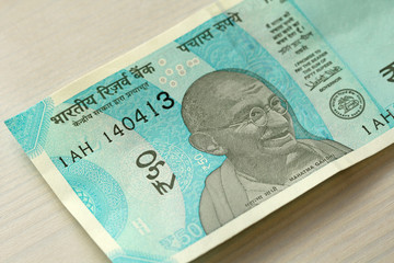 A new banknote of India with a denomination of 50 rupees. Indian currency. Portrait of Mahatma...