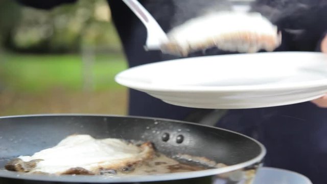 A close up shot of turbot meat fish fried in butter.